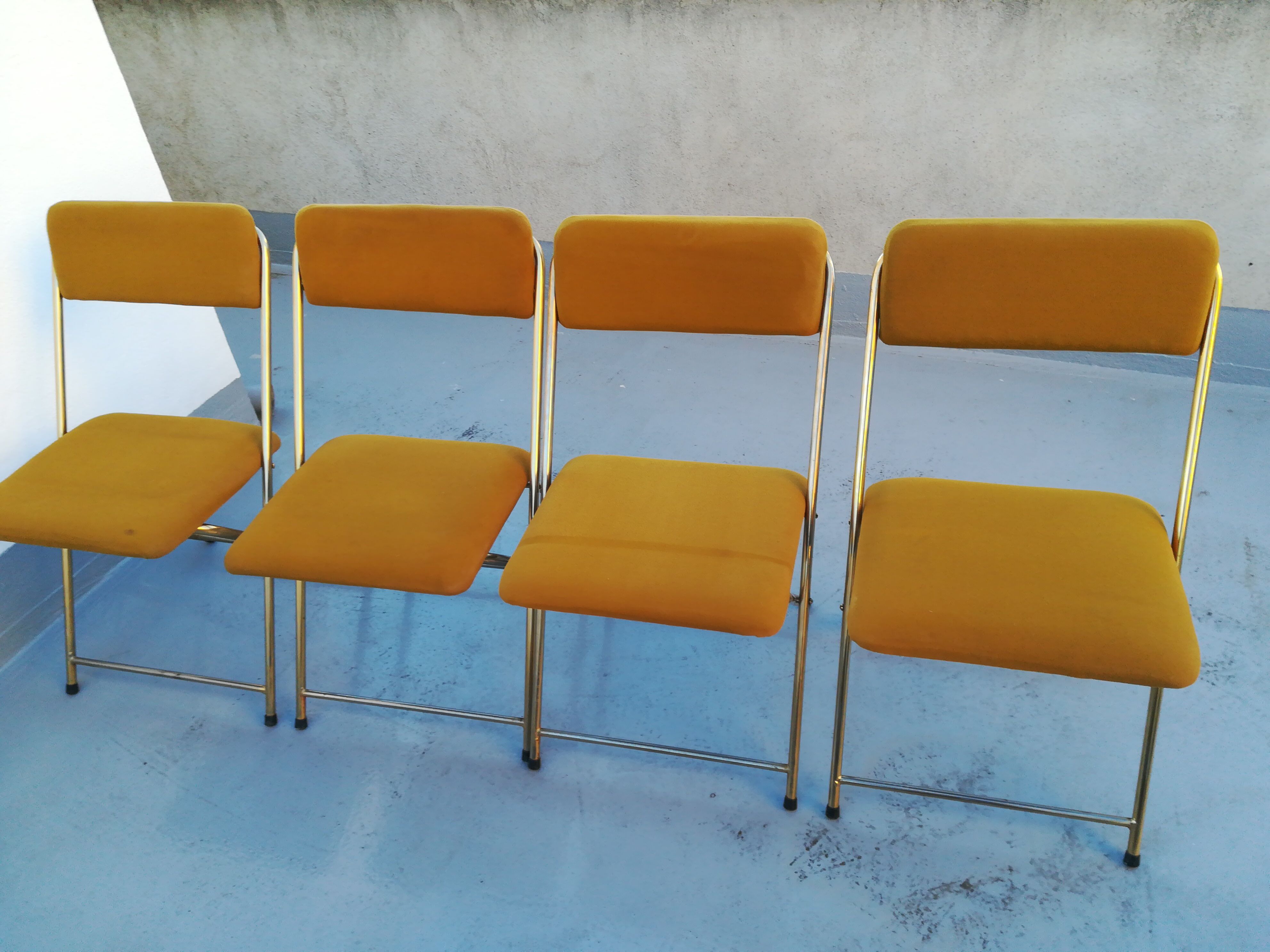 4 folding gold vintage Eyrel chairs