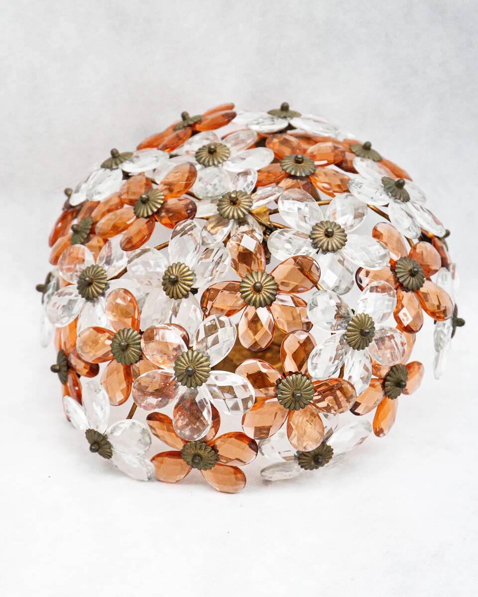 Ceiling light with transparent and peach flowers.