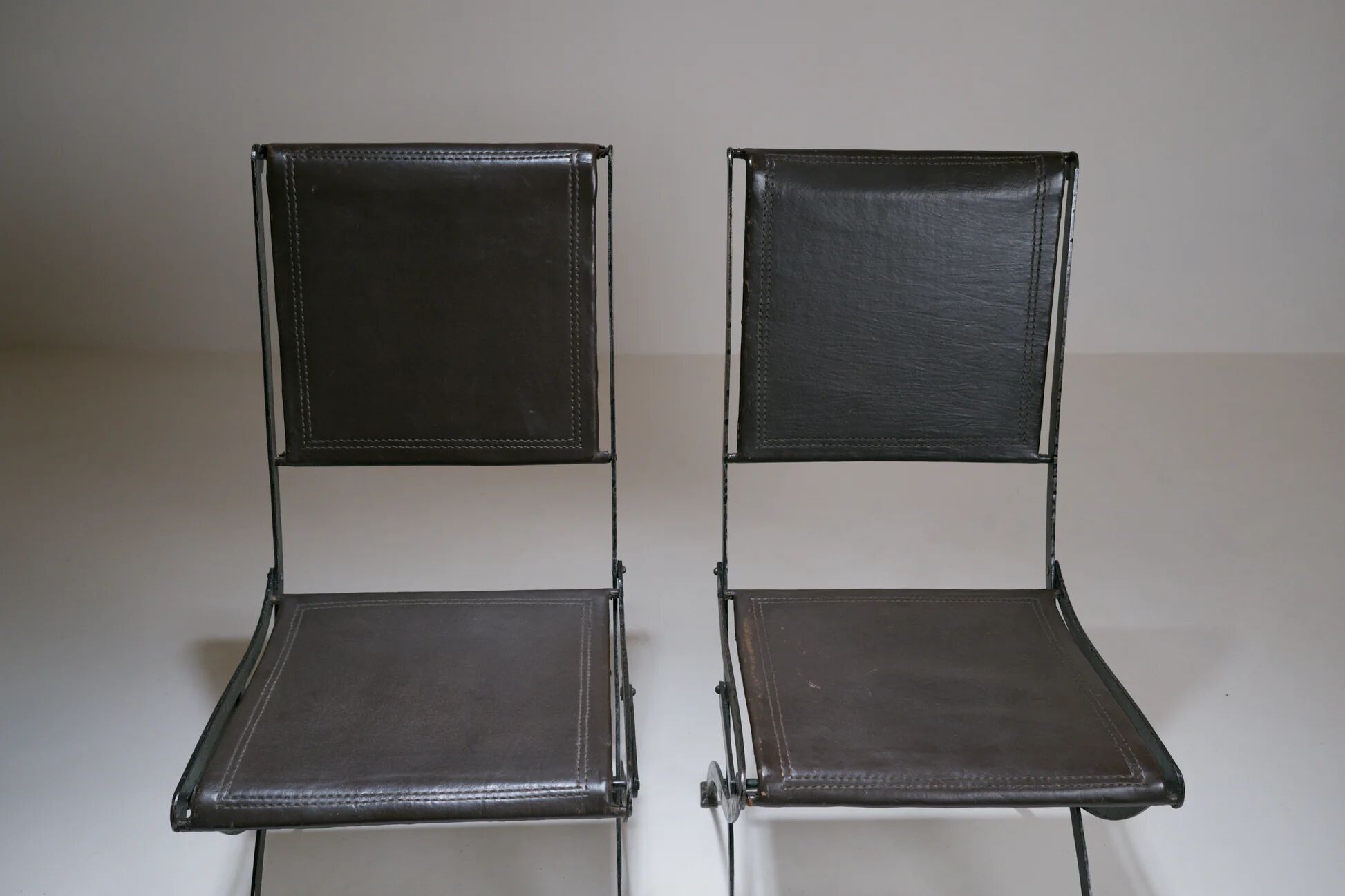 Foldable chair in wrought iron and leather. c. 1950