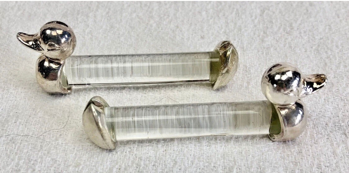 12 silver-plated metal duck knife rests with crystal.