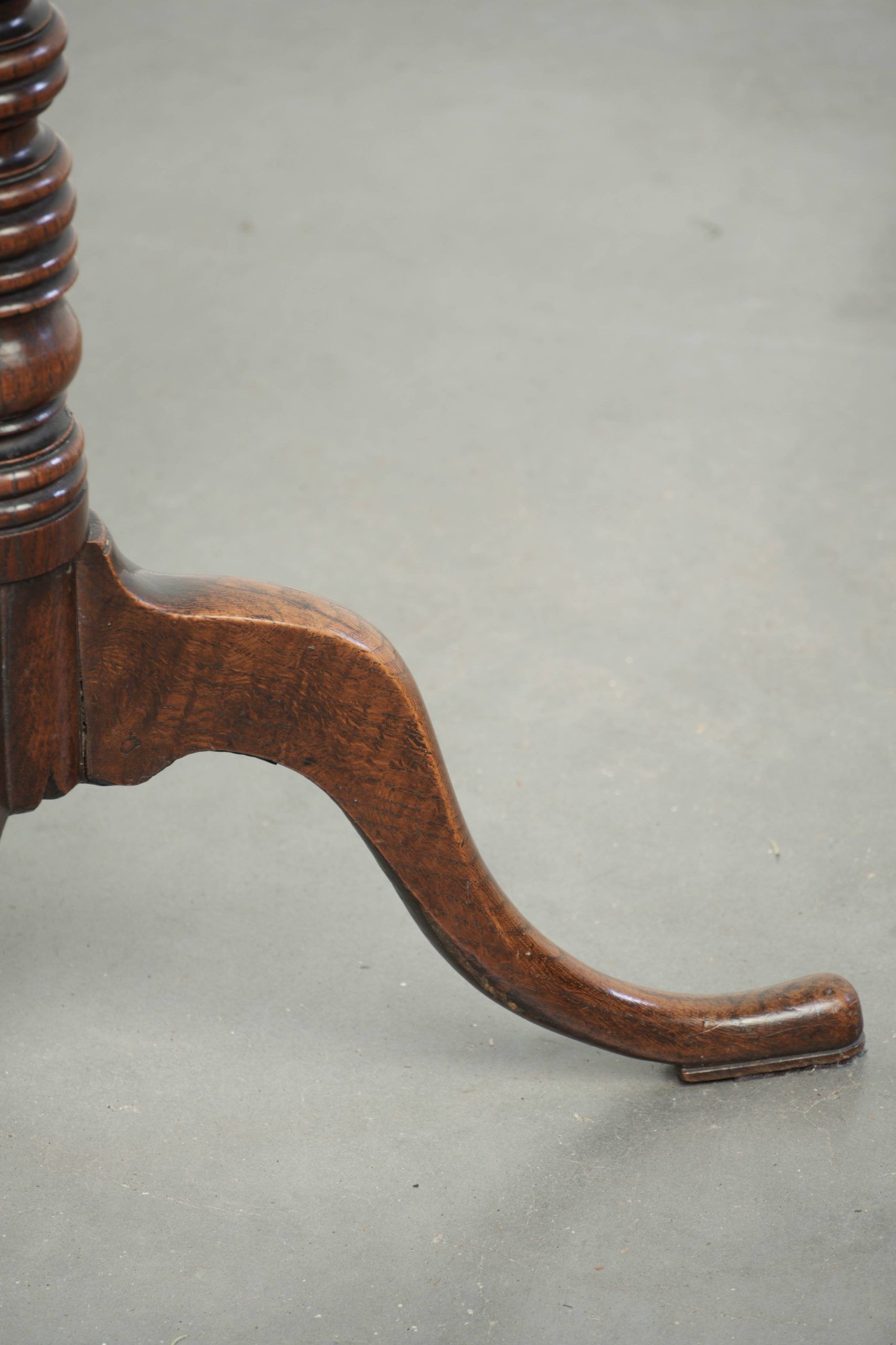 Antique English oak tilt top table from the 19th century in a unique shape