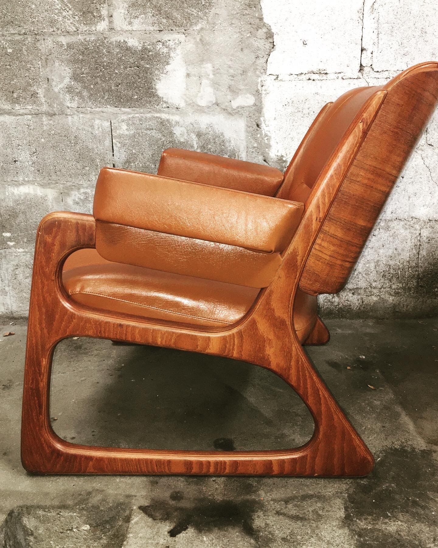 Armchair called "sled" Publisher Baumann and Ottoman