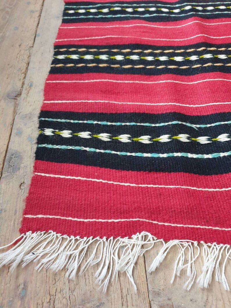 Hand-woven red wool rug