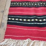 Hand-woven red wool rug