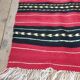 Hand-woven red wool rug