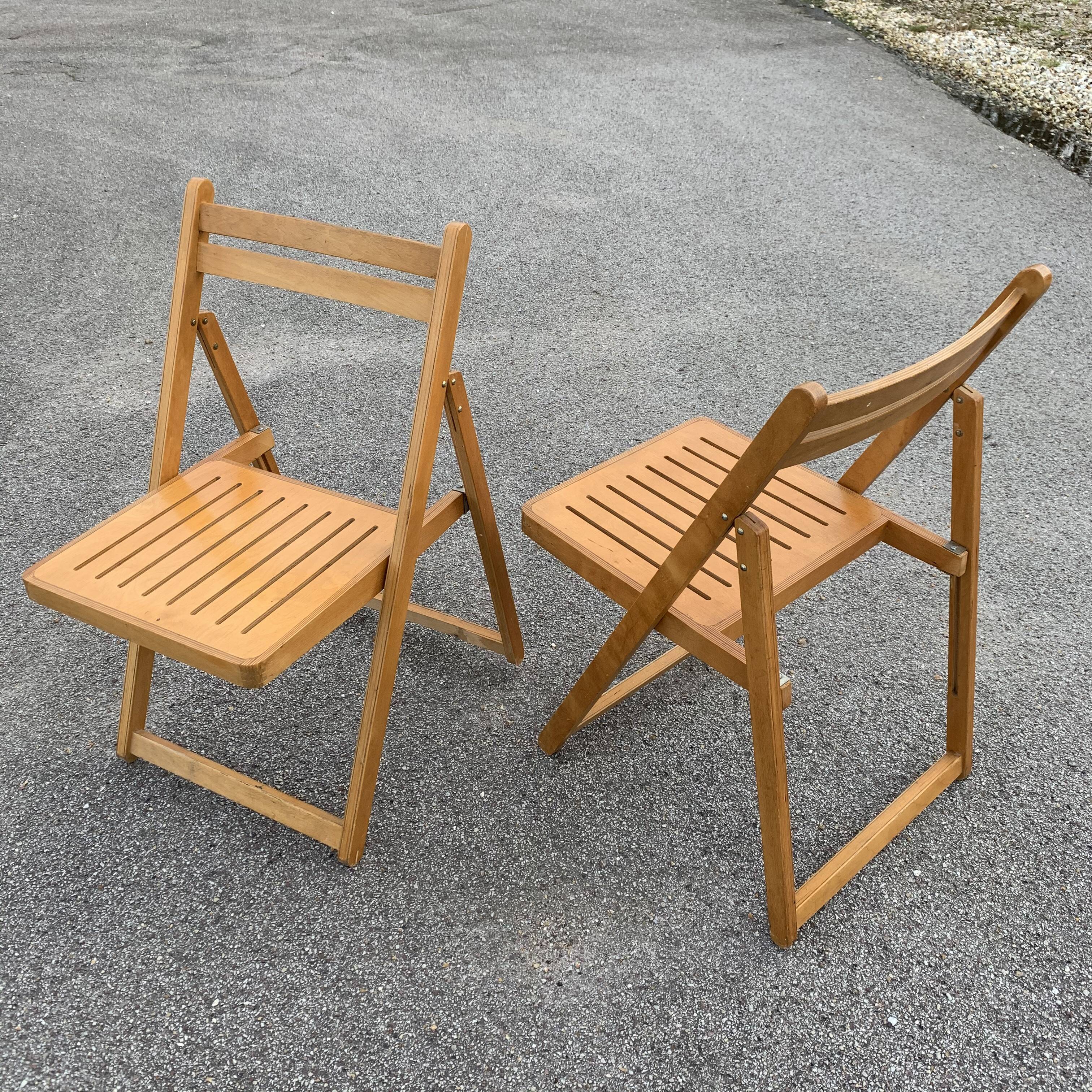 Pair of folding wooden chairs