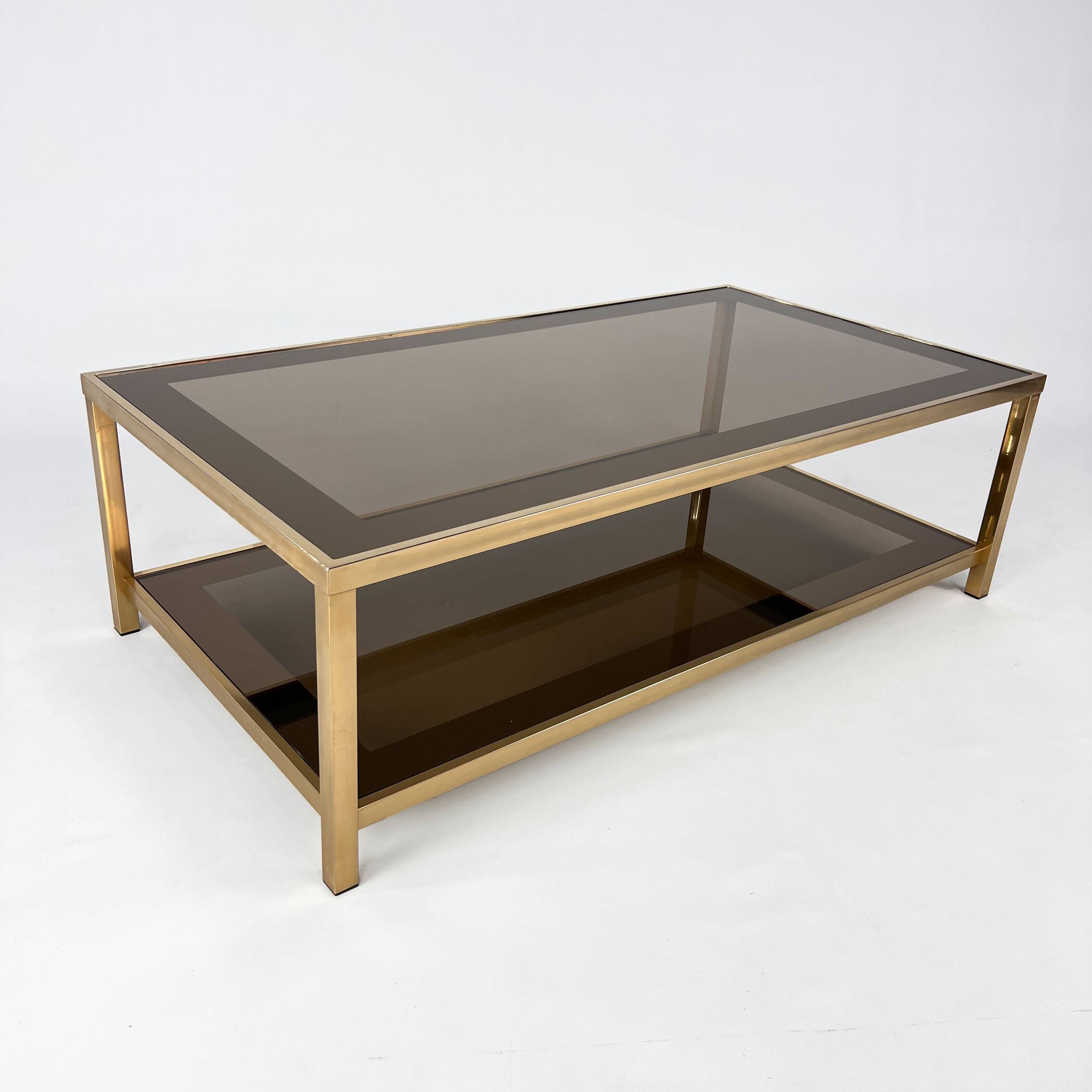 Belgo Chrome coffee table in brass and smoked mirror glass, 1970s.