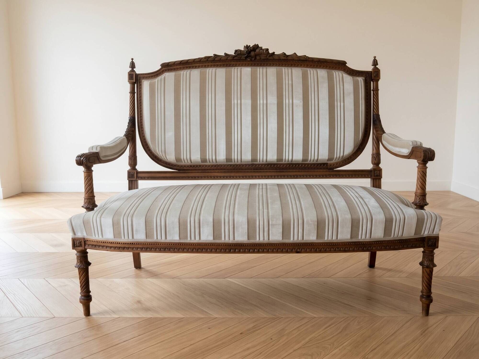 Louis XV style classic canapé reupholstered in striped beige fabric.