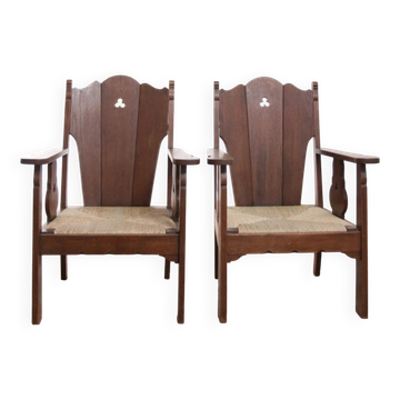 Pair of low Brutalist oak lounge chairs with new rush seats – circa 1935