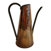 Watering can from the 1950s, made of hammered copper and brass