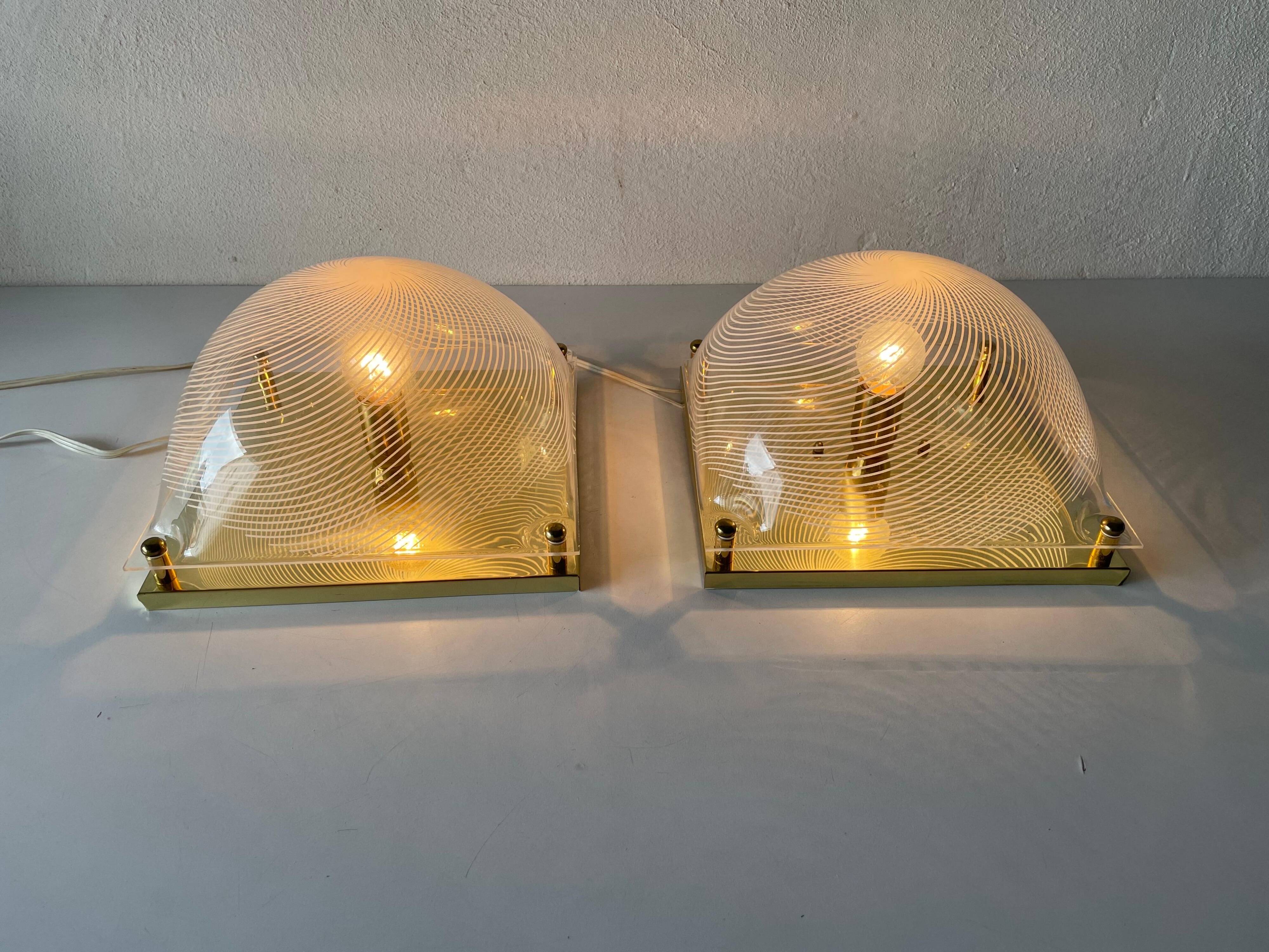 Pair of wall lights or flush mounts in plexiglass by Leola, 1970s, Germany.