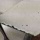 Glass art deco mirror beside table