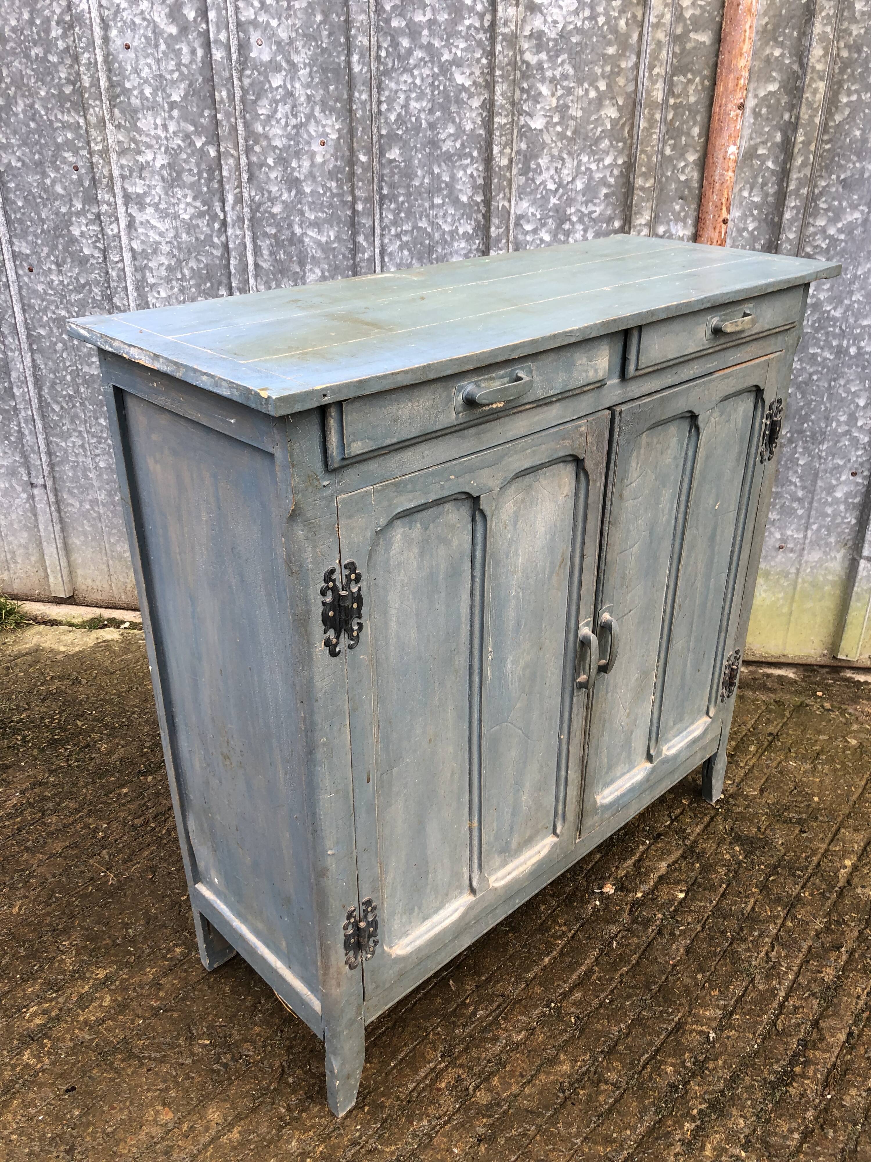 Parisian sideboard painted in blue with 2 doors and 2 drawers.