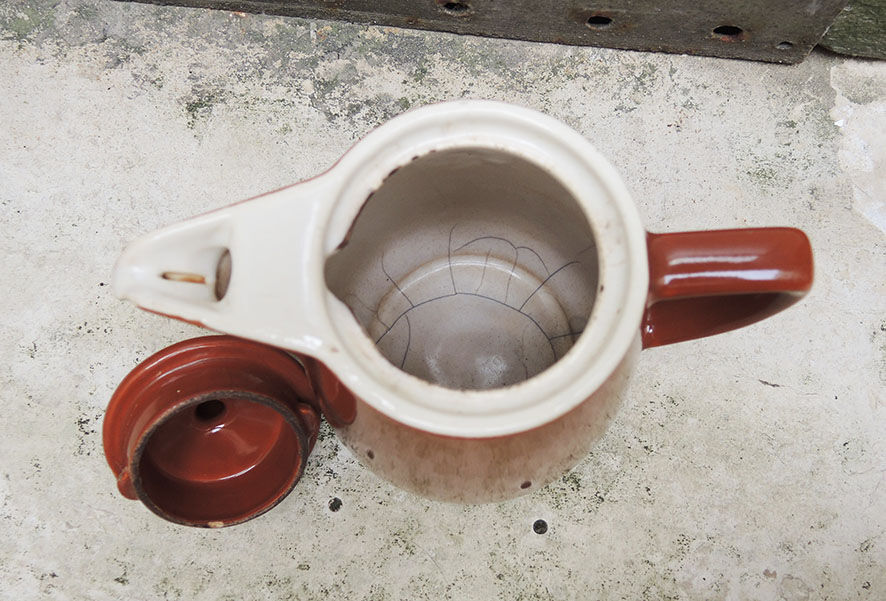 Old brown ceramic coffee maker