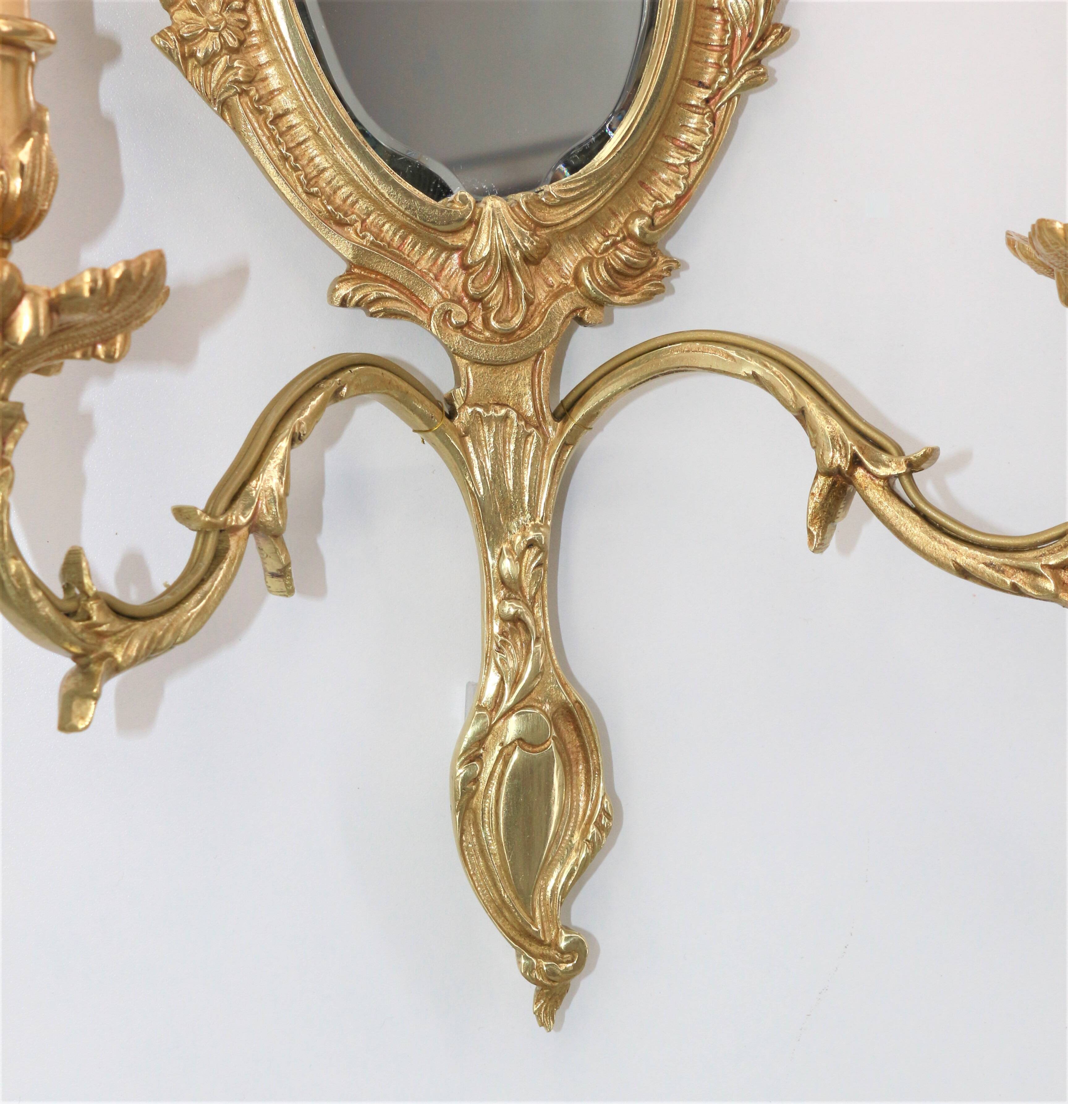 Pair of Louis XV style beveled mirror sconces in bronze by Lucien Gau
