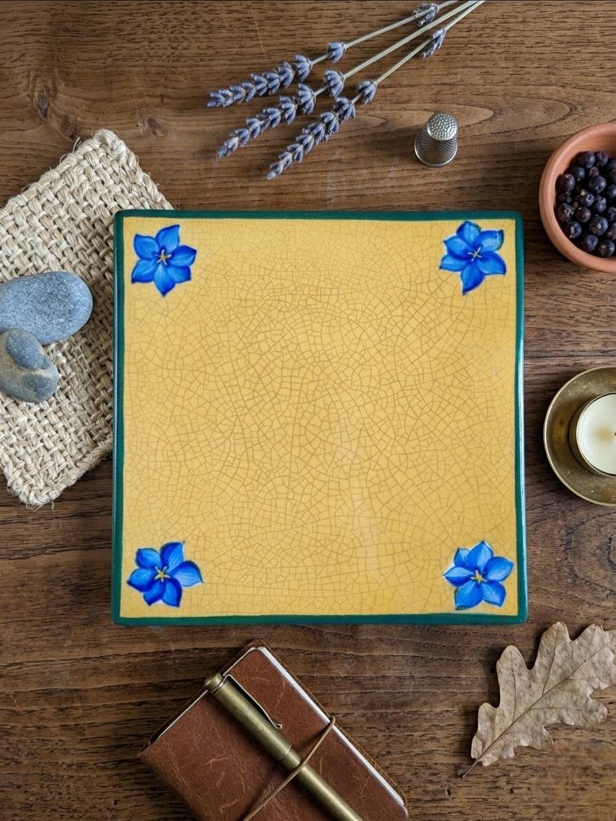 Yellow glazed ceramic trivet signed l. drimmer