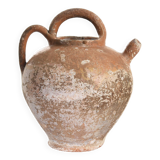 Old water jug. Gargoulette. Old terracotta pitcher.