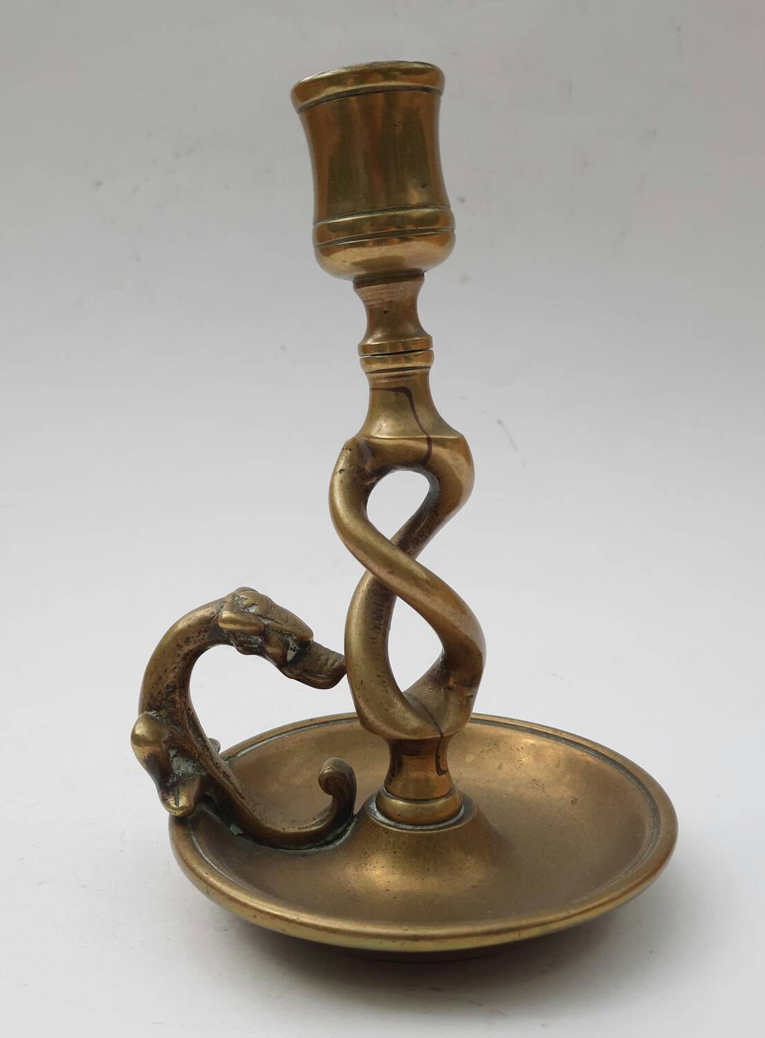 Antique bronze candlestick with dragon-shaped handle from the 17th century