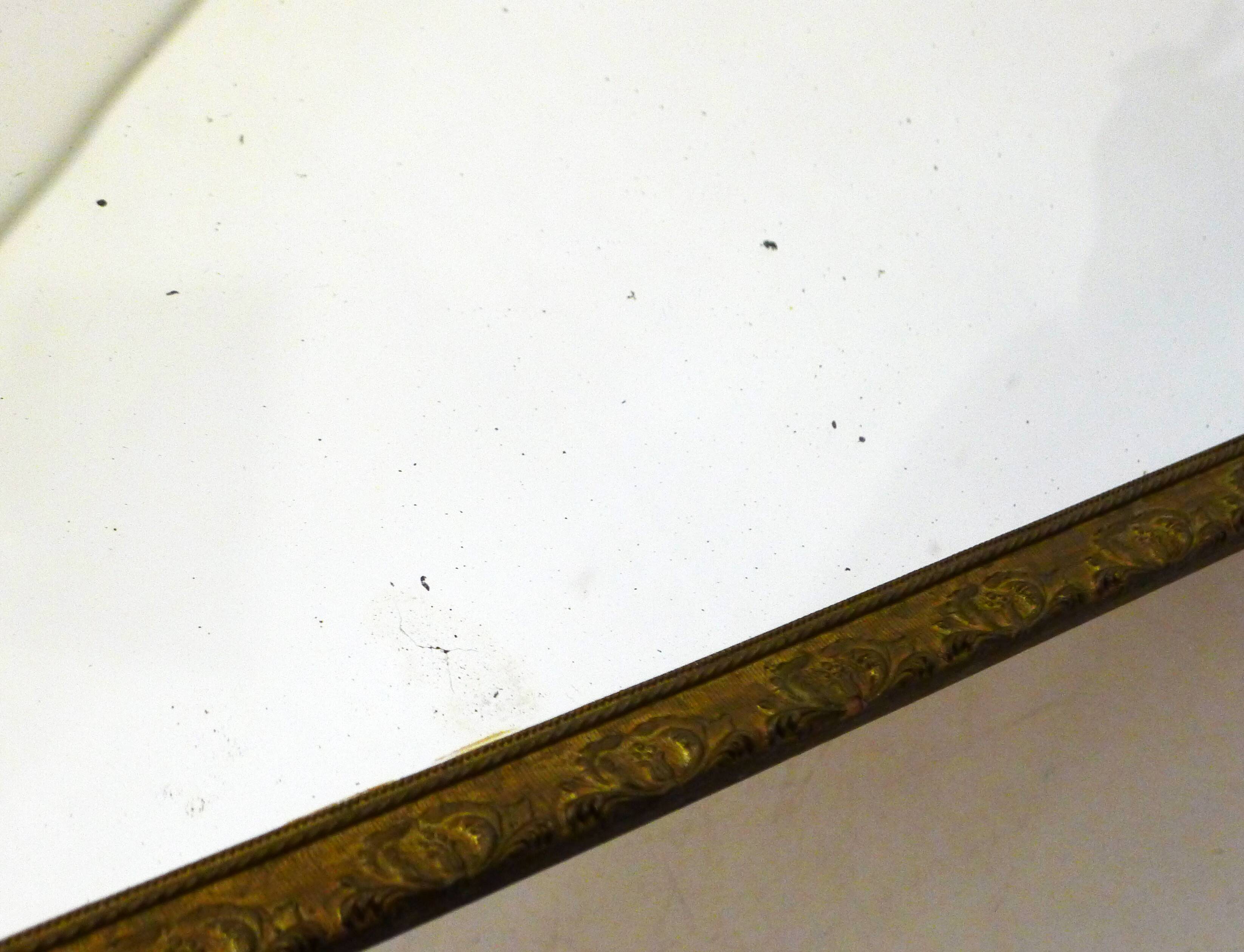 Large elongated gilded mirror