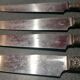 Old table knives and dessert knives, wooden handles, stainless steel blades