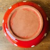 Red ceramic salad bowl with white polka dots