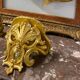 Golden wall applique with gold leaf