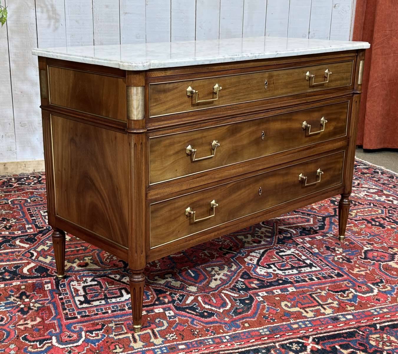 Louis XVI commode in mahogany with a marble top from the 1950s.