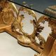 Antique coffee table in gilded wood with a glass top, Italy, 20th century.