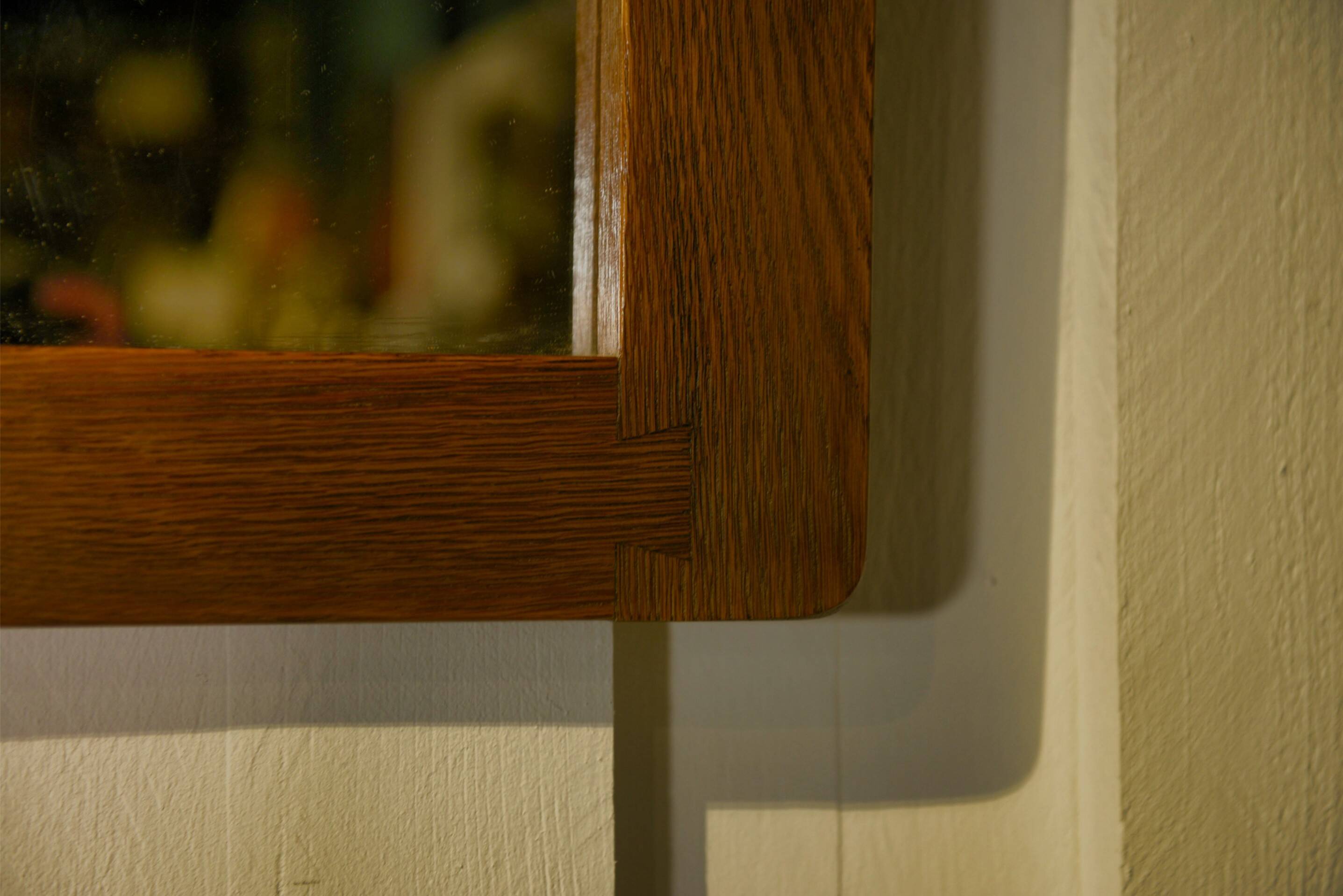 Brutalist mirror in solid oak with metal ring, 1960s.