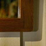 Brutalist mirror in solid oak with metal ring, 1960s.