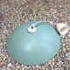Pastel green metal pendant light. White cord.