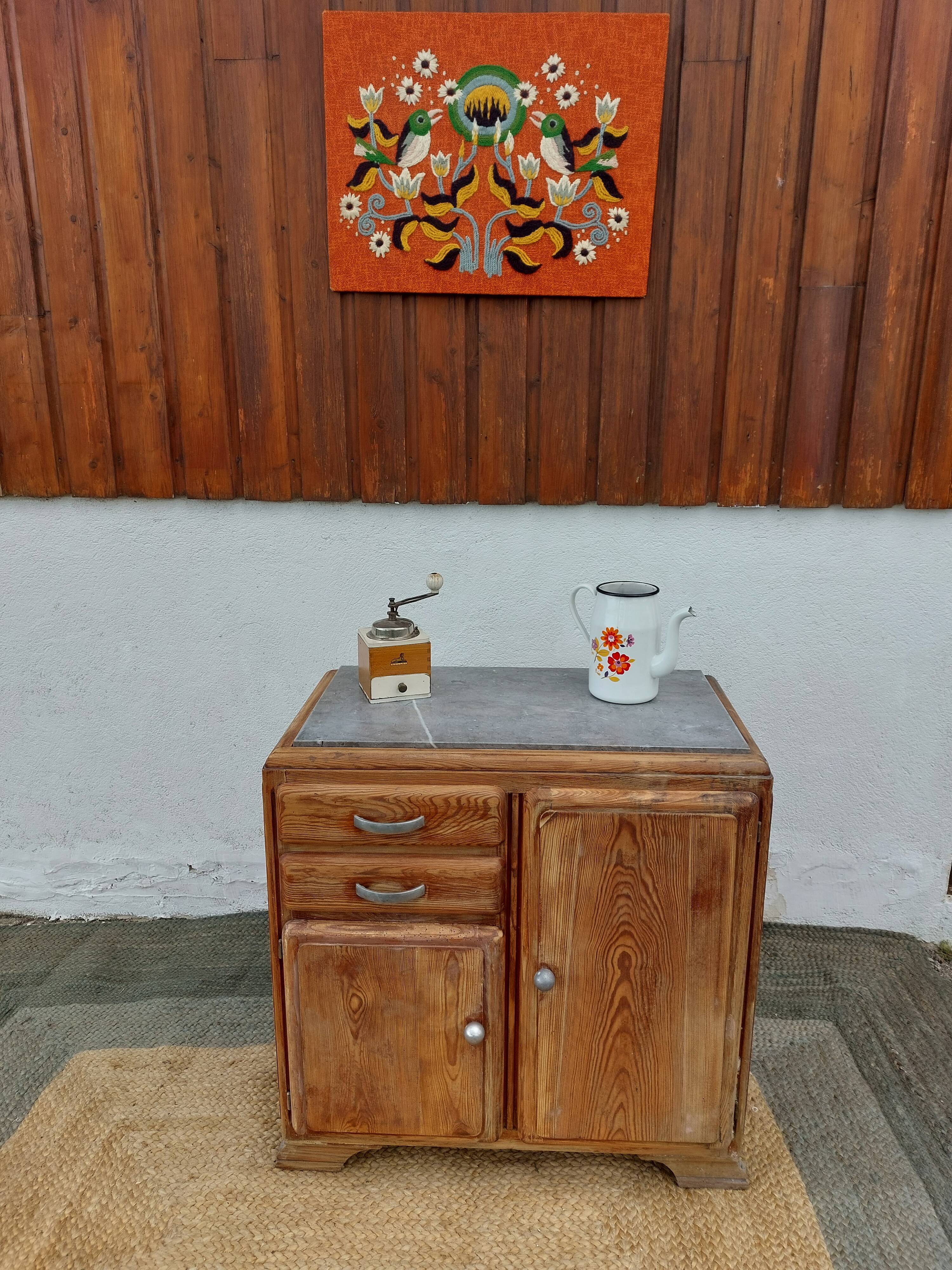 Vintage wooden buffet with a marble top.