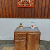 Vintage wooden buffet with a marble top.