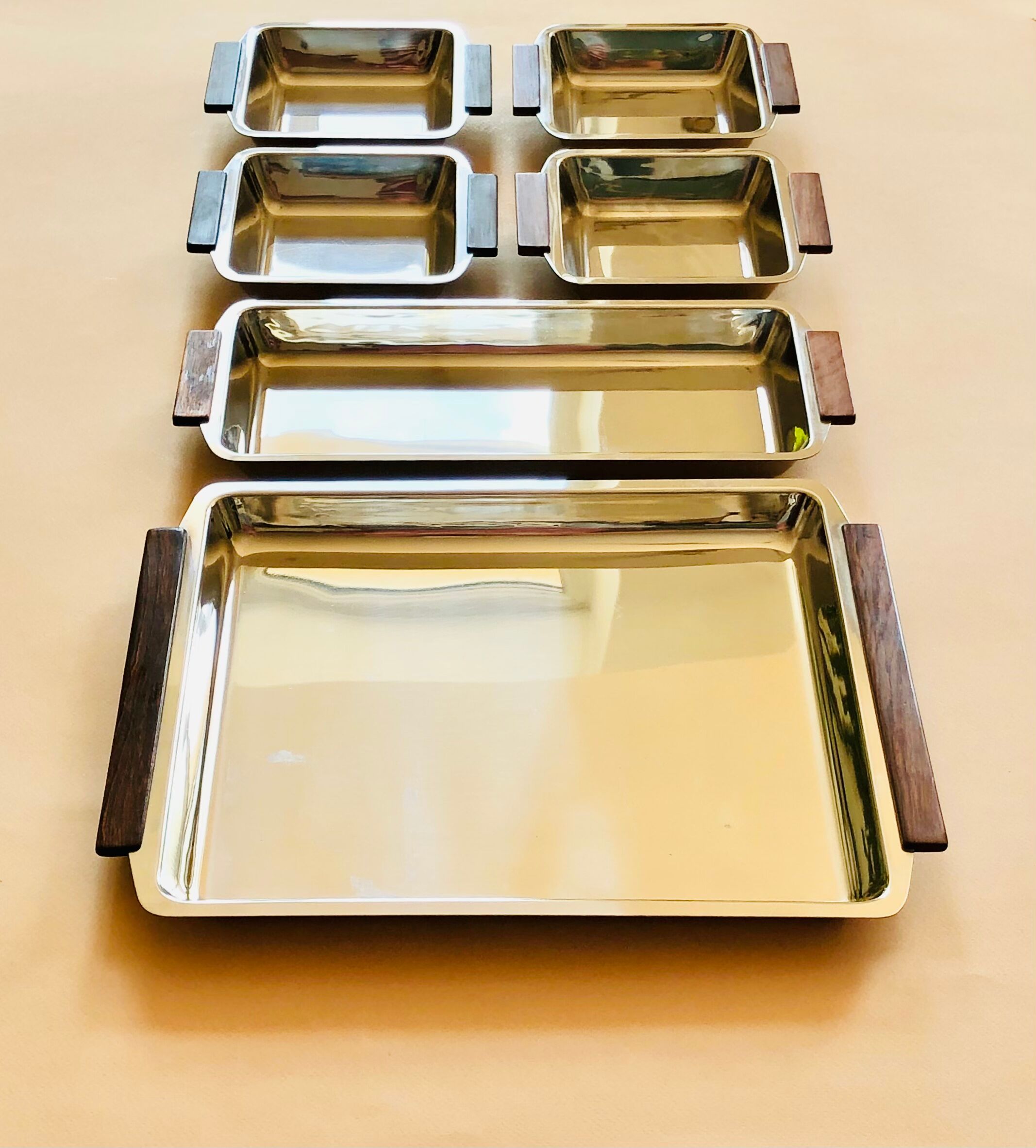 Service of Scandinavian dishes in stainless steel and teak 1970