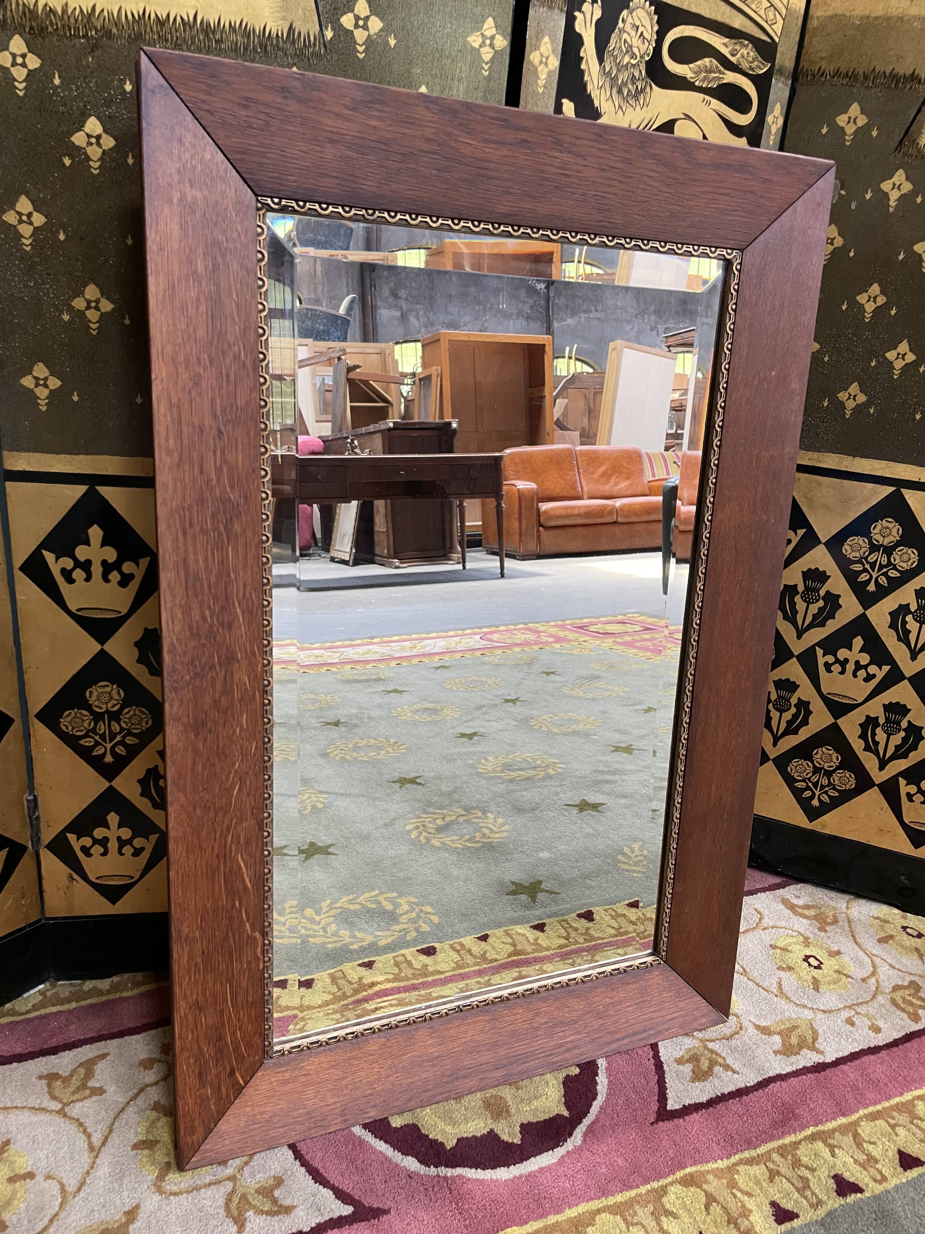 Oak mirror and old golden border