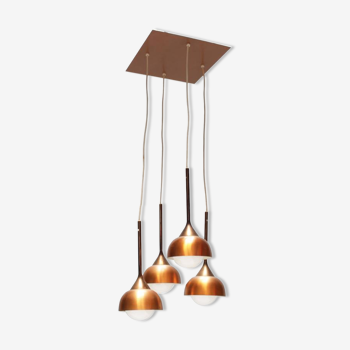 Luminaire with four copper pendants