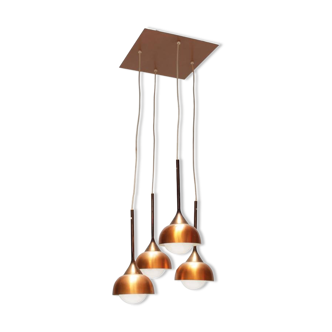 Luminaire with four copper pendants