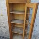 Showcase an old door, small bookshelf.