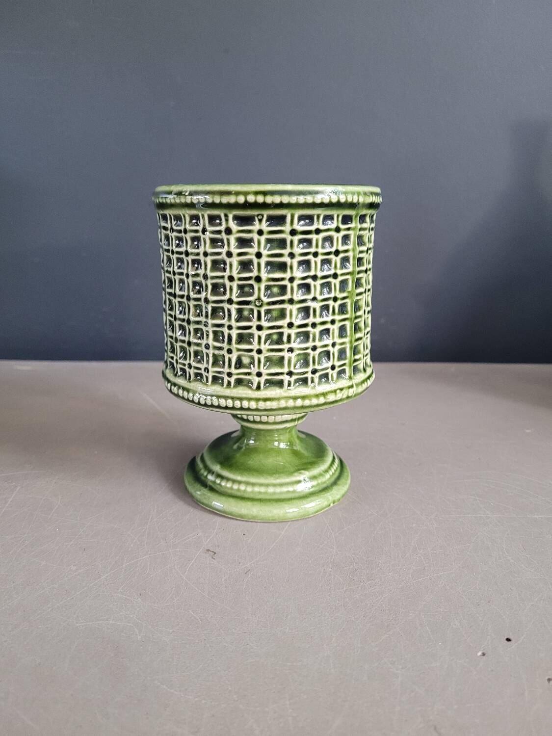 Ceramic flowerpot on stand
