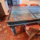 Large antique Indian dining table made of teak wood with patina.