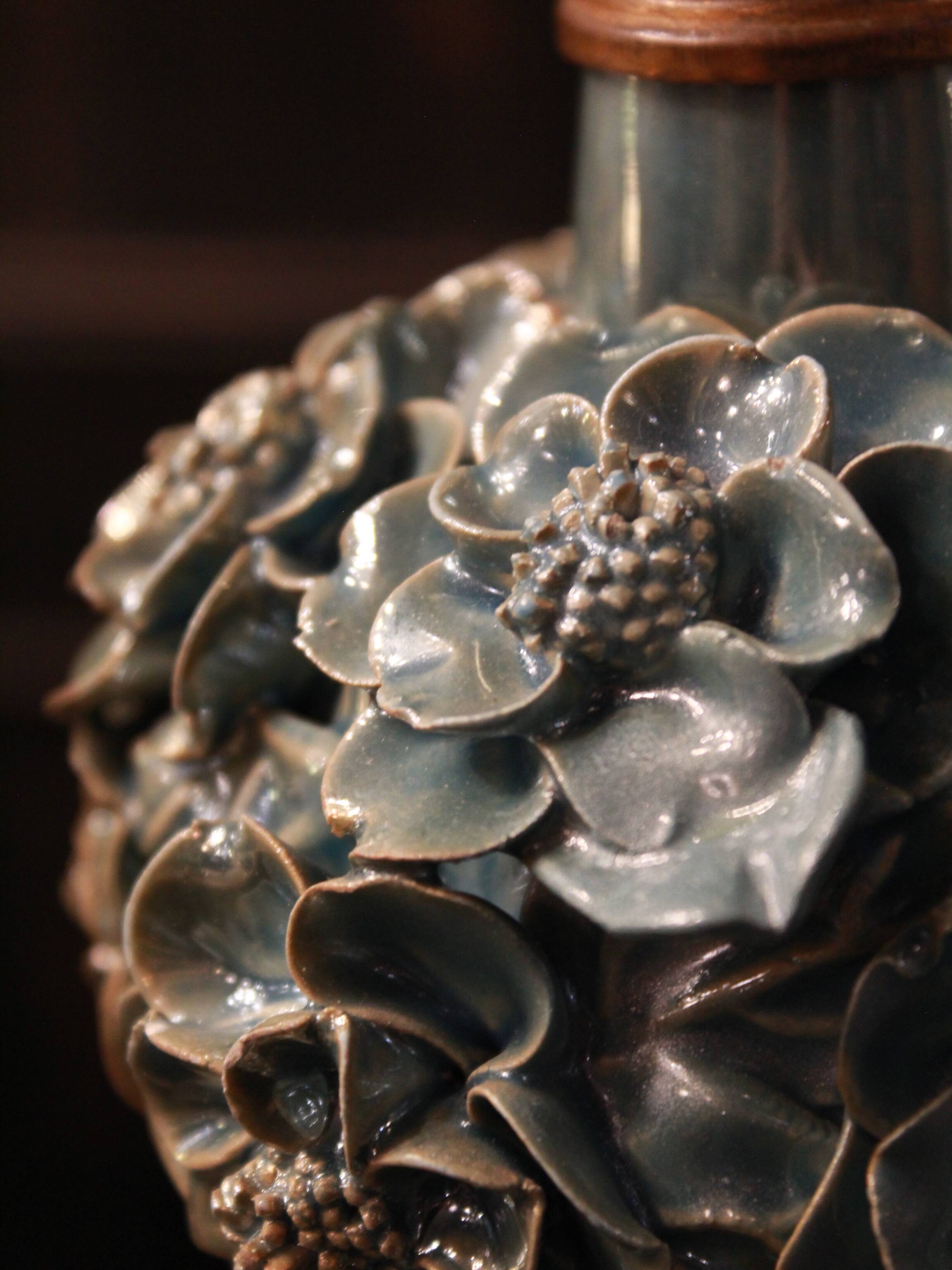 Pair of iridescent light blue lamps, featuring a floral bush design
