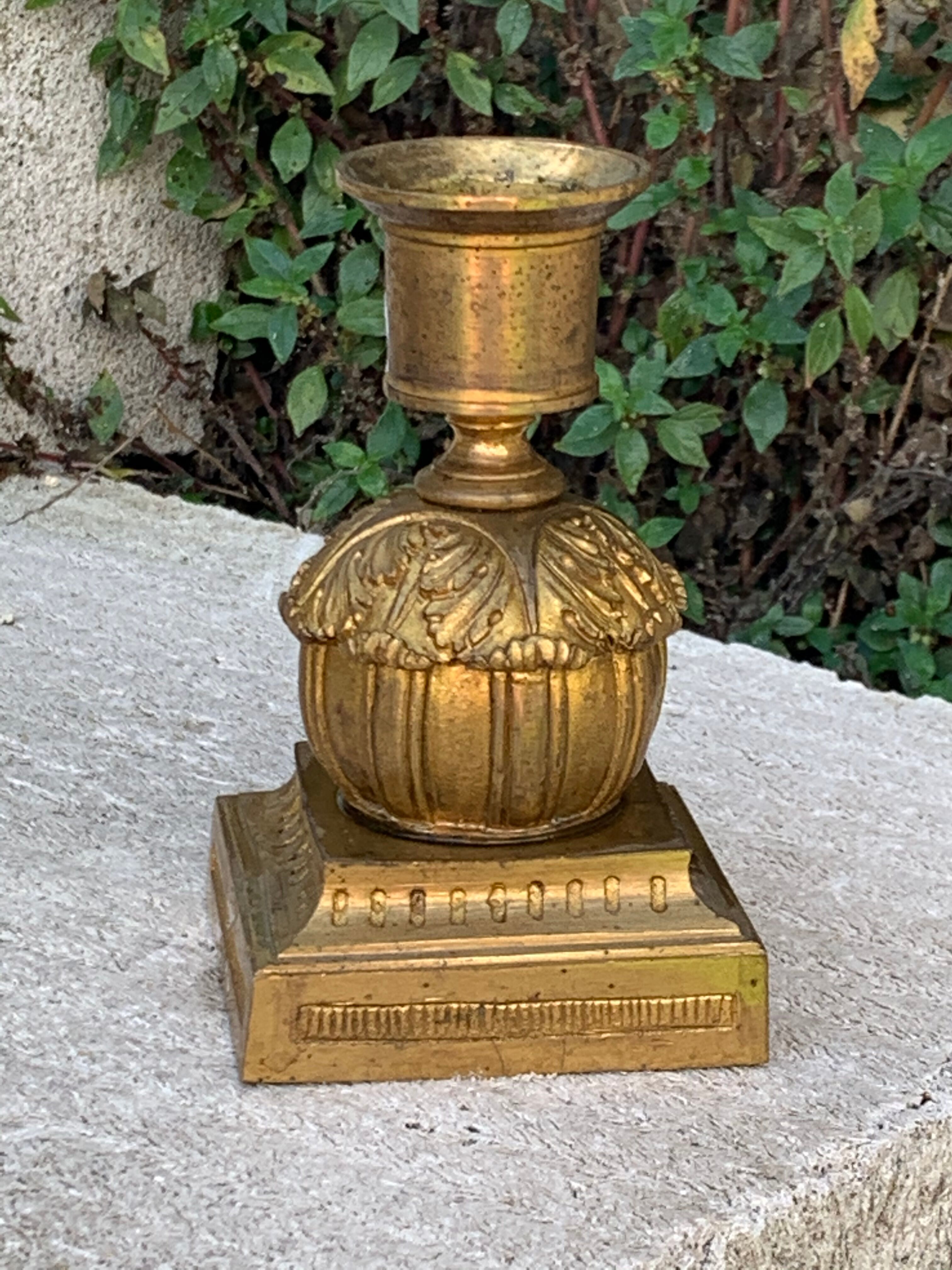 Very original old candlestick, chiseled with its gold patinated foliage