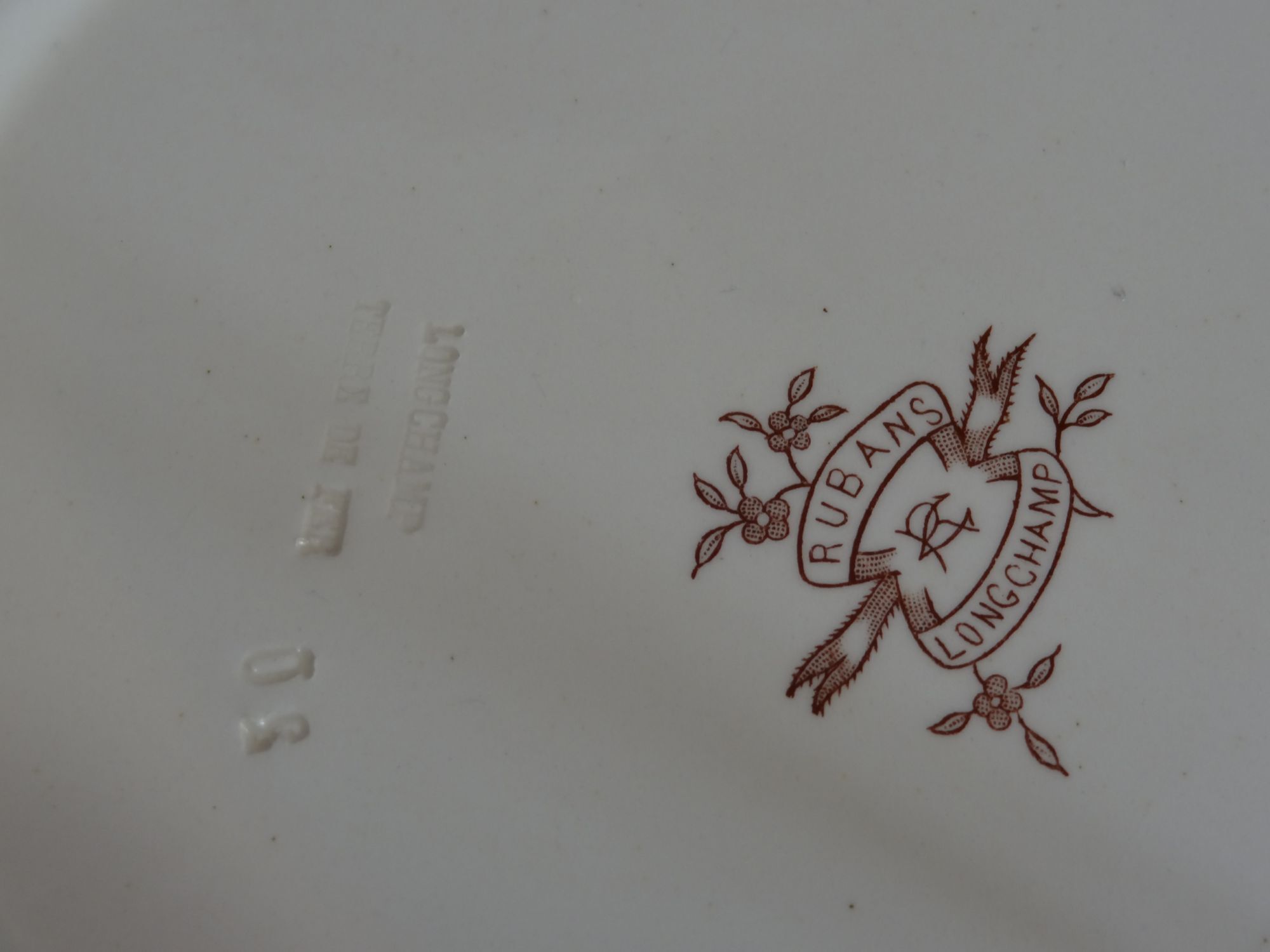 6 hollow earthenware plates Terre de fer, model Ribbons from Longchamp