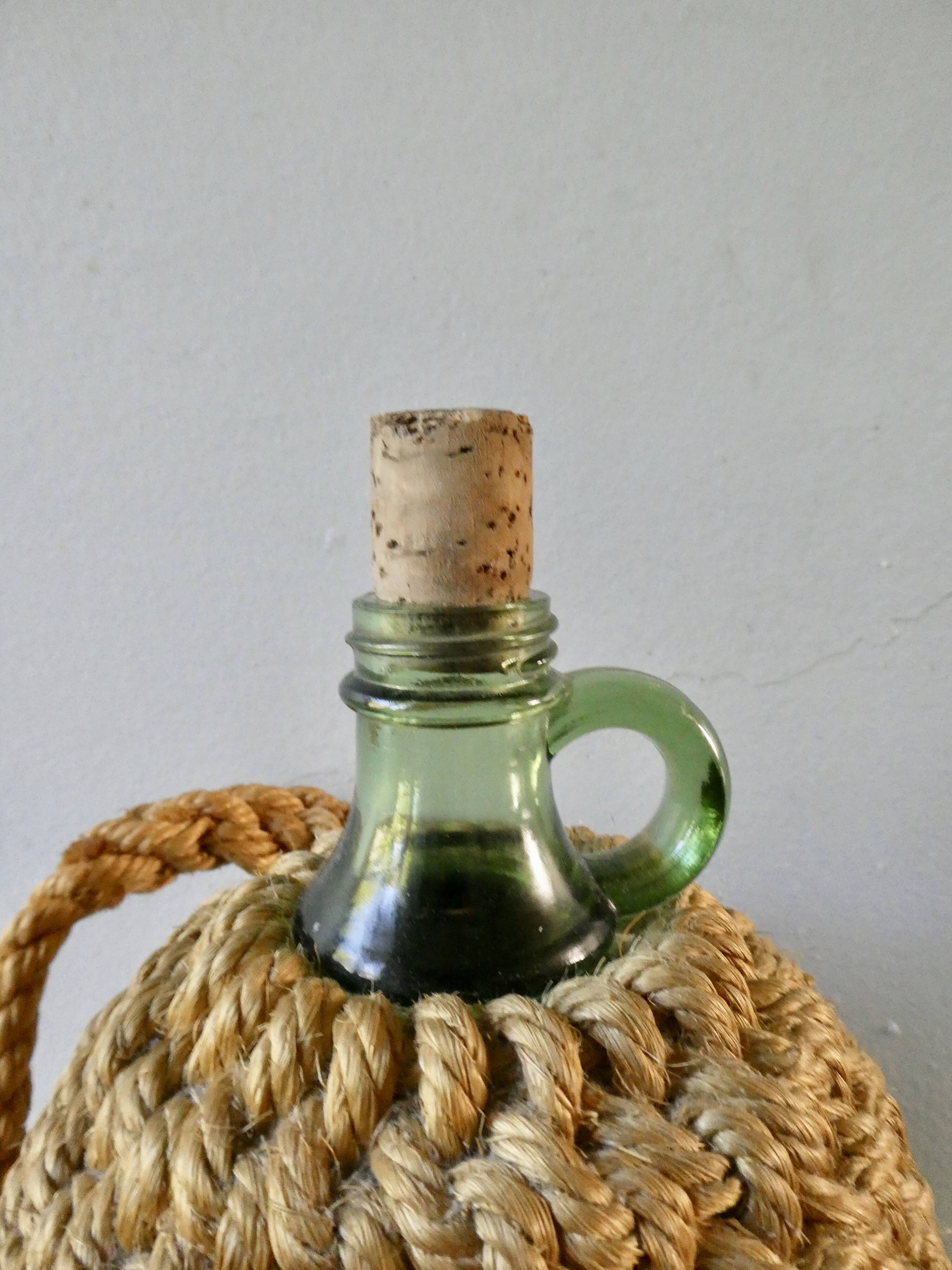 Glass bottle with braided rope, 60s