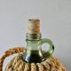 Glass bottle with braided rope, 60s