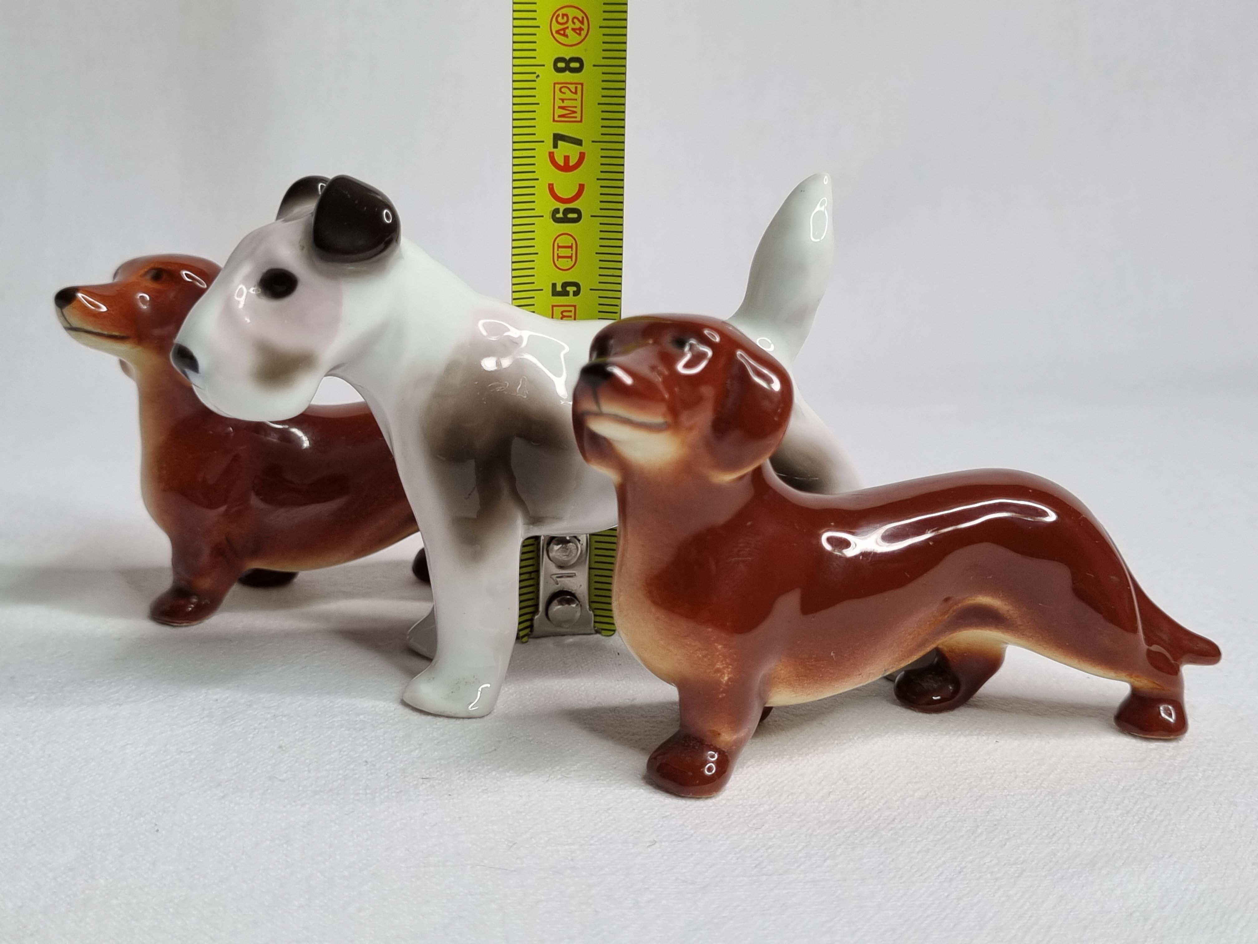 Set of three porcelain puppies