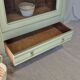 Glass display cabinet with drawer