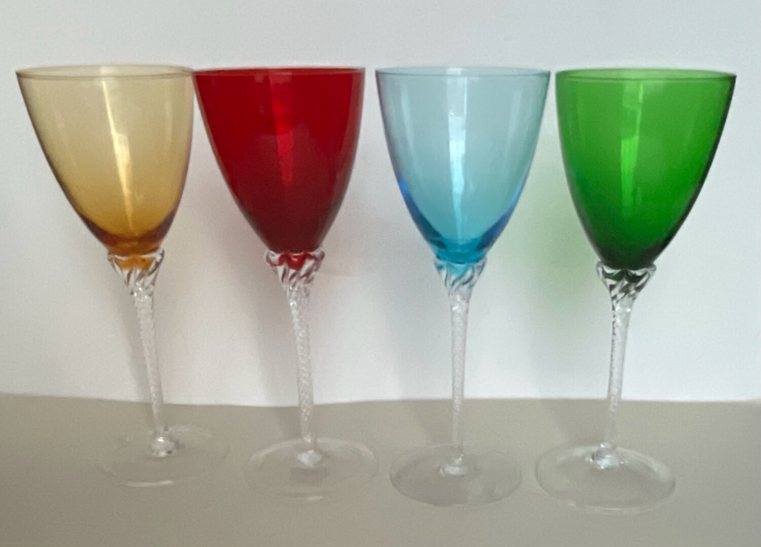 4 coloured stemmed glasses