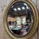Oval mirror Napoleon III – Gilded with gold leaf – Wood and stucco