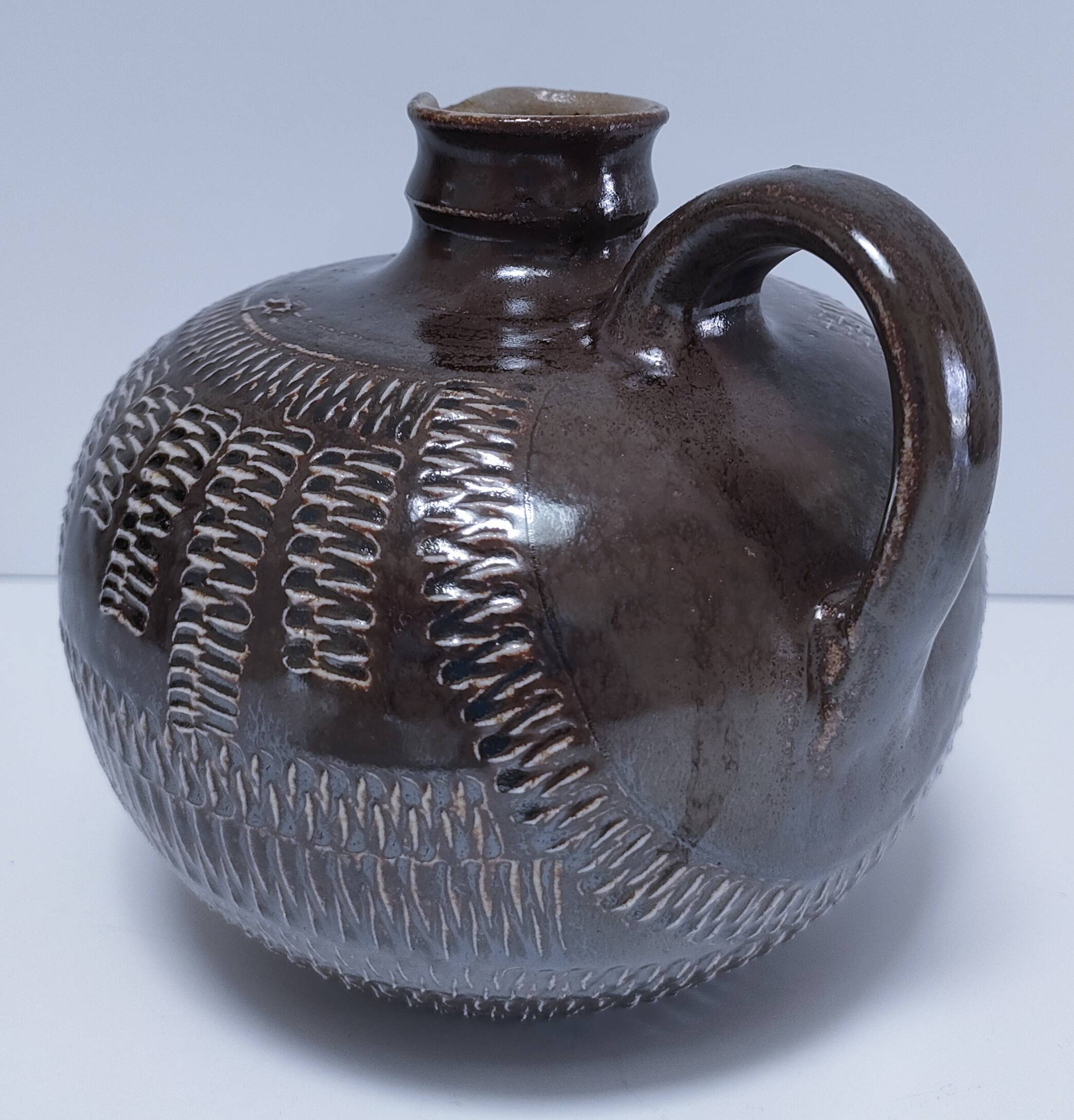 Vintage scarified glazed stoneware pitcher